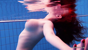 Saucy bitch swimming in the pool naked giving quiet the show