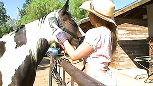 Ardent beauty in cowgirl hat goes interracial to be pounded doggy hard