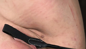 Ample tattooed hussy gets her nasty shaved cunt slapped with lash