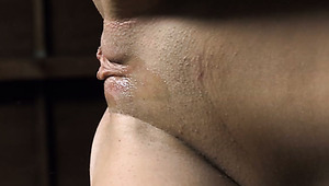 Luscious brunette hottie gives head to strapon while getting fucked with another strapon