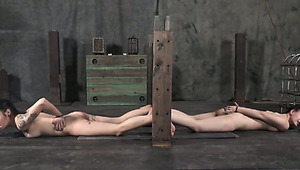 Dirty tattooed bitch smokes cigarette with hands cuffed in BDSM sex clip