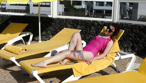 Hot and slutty bikini girl Bea Triss takes sexy poses on the deck chair
