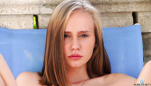 Torrid alone cutie Alicia Williams has fun on deck chair fingering herself