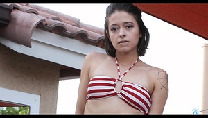 Too naughty naked brunette Izzy Bell has fun fingering her slit on the deck chair