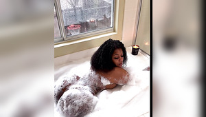 Seductive curvy ebony chick sucks BBC in a bathtub and then she gets her hole stuffed pretty hard in bed