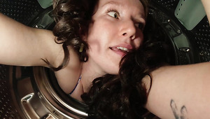 A hot brunette girlfriend gets stuck and banged in a washing machine